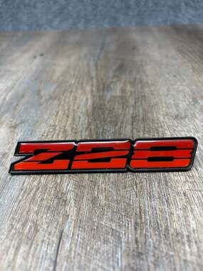Chevrolet Camaro Z28 Red Rocker Panel Emblem (1982-1984) part-14931725 - OEM-EUC